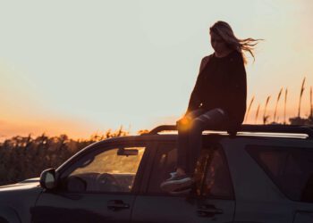 Girl on the roof of a car