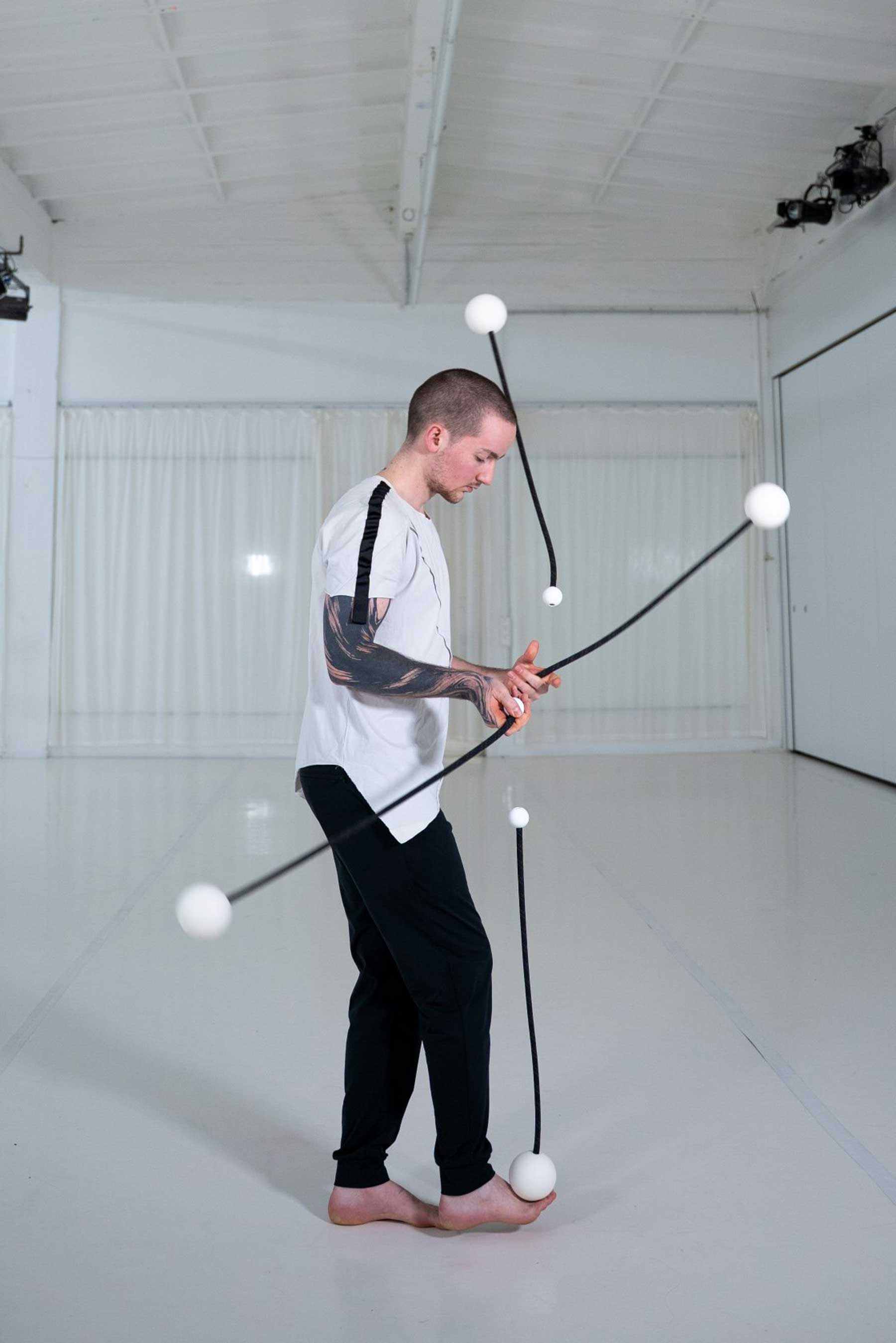 Alexandre Delquié (Bow) beim Training mit Poi